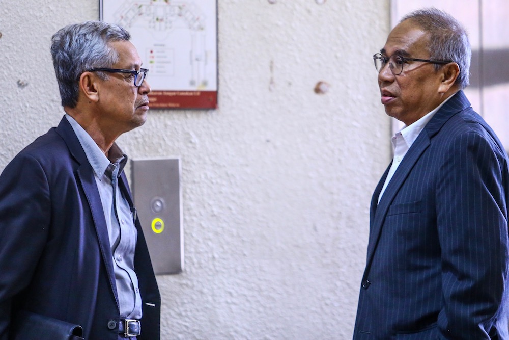 Former Finance Ministry deputy secretary-general (Policy), Datuk Mat Noor Nawi (right) and former Finance Ministry secretary, Datuk Maliami Hamad, are seen at the Kuala Lumpur Court Complex July 9, 2019. u00e2u20acu201d Picture by Hari Anggara