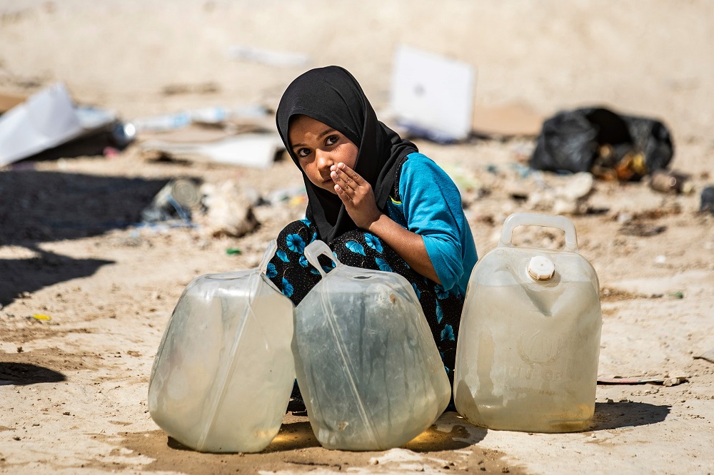 A displaced Syrian girl washes her mouth at al-Hol camp for the internally displaced people in al-Hasakeh governorate in northeastern Syria July 23, 2019. u00e2u20acu201d AFP pic        