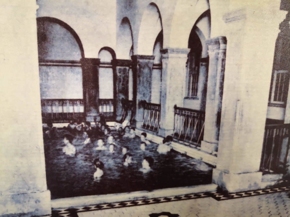 A historical photograph shows the Beitou public bathhouse in use before it was converted into a museum in Taipei, Taiwan. 