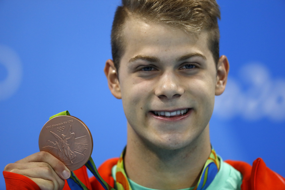 In this file photo taken August 10, 2016 Hungaryu00e2u20acu2122s Tamas Kenderesi poses with his bronze medal on the podium of the Menu00e2u20acu2122s 200m Butterfly Final during the swimming event at the Rio 2016 Olympic Games at the Olympic Aquatics Stadium in Rio de Janeiro. u00e2