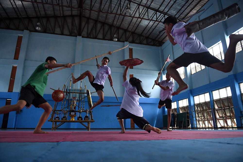 This photo taken on July 8, 2019 shows students practising Krabi Krabong, a Thai martial art, at the Thonburee Woratapeepalarak school in Thonburi, on the outskirts of Bangkok. u00e2u20acu201d AFP pic         