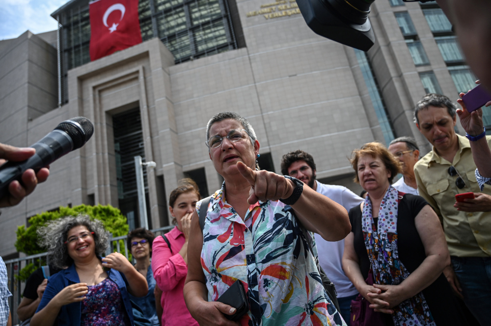 Human rights activist Sebnem Korur Fincanci answers journalistsu00e2u20acu2122 questions July 17, 2019 in front of Istanbulu00e2u20acu2122s courthouse after an Istanbul court acquitted her along with the Turkey representative for Reporters Without Borders (RSF) and another right