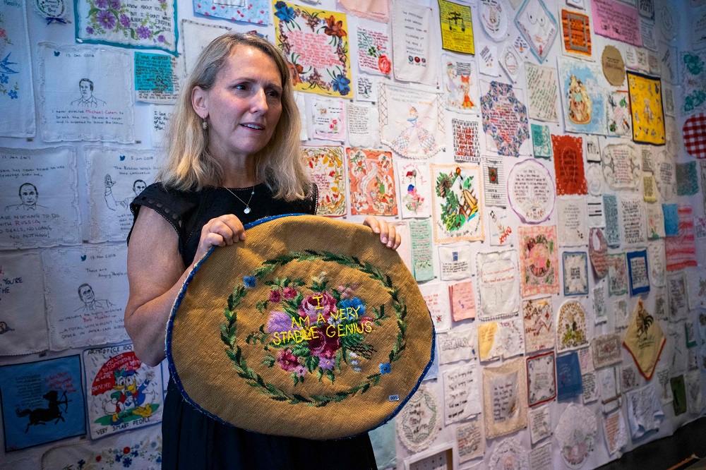 Textile artist Diana Weymar shows the first piece of her ‘Tiny Pricks Project’ at the Lingua Franca store during a interview with AFP in New York July 25, 2019. — AFP pic         