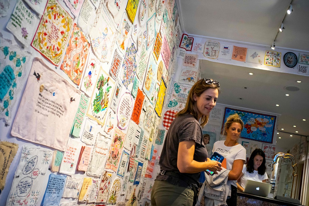 People take a look at the ‘Tiny Pricks Project’ at the Lingua Franca store in New York July 25, 2019. — AFP pic         