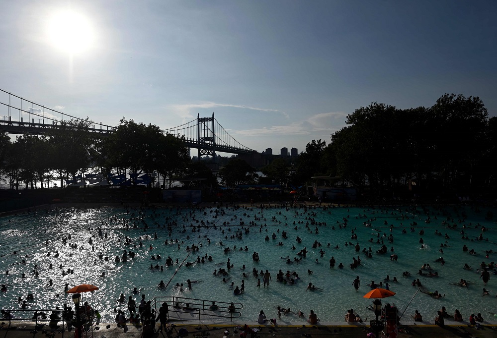 People enjoy the Astoria Pool on a hot afternoon in the borough of Queens, New York July 20, 2019. u00e2u20acu201d AFP pic          