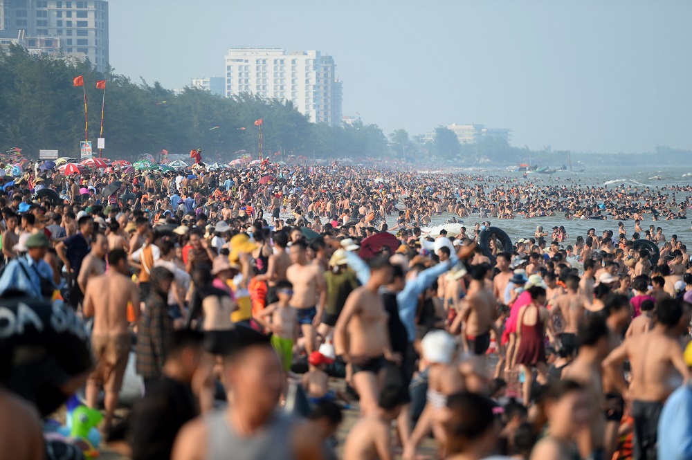 This picture taken on July 20, 2019 shows people relaxing on Sam Son beach in Thanh Hoa province. u00e2u20acu201d AFP pic            