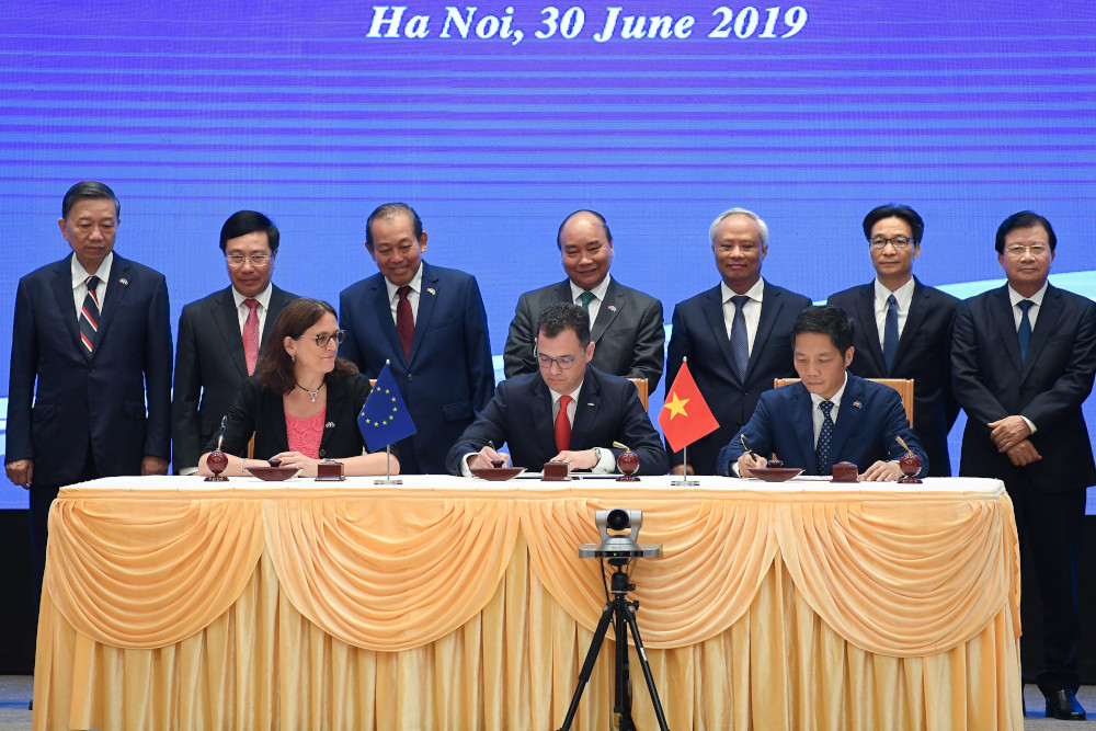 European Commissioner for Trade Cecilia Malmstrom and Vietnamu00e2u20acu2122s Minister of Industry and Trade Tran Tuan Anh sign the EU-Vietnam FTA in Hanoi June 30, 2019. u00e2u20acu201d AFP pic 