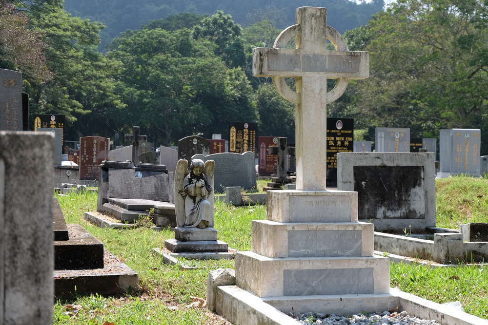 Often angel and cherub statues marked the graves of those who died young at the Western Road Cemetery. — Picture by Steven Ooi KE