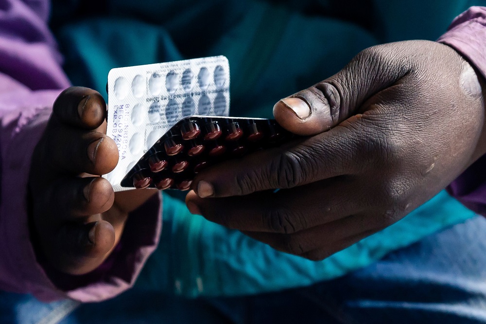 Blessing Chingwaru, 29, an HIV positive TB patient, holds a packet of tablets received as part of his treatment at Rutsanana Polyclinic in Glen Norah township, Harare June 24, 2019. u00e2u20acu201d AFP pic          