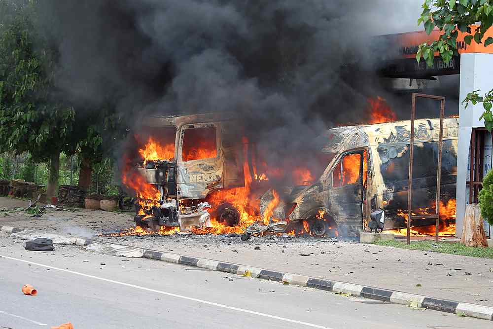 An ambulance and a fire engine set on fire by a Shi'ite group are seen at the Federal Secretariat in Abuja, Nigeria July 22, 2019. u00e2u20acu201d Reuters pic