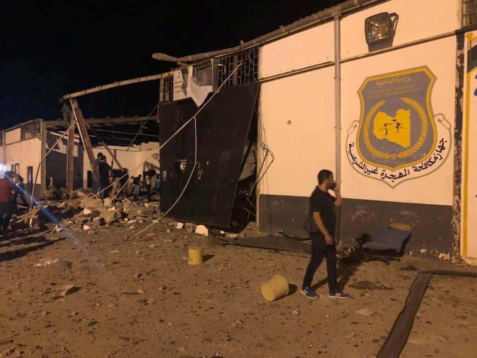 A man walks next to the damaged building of a detention centre for mainly African migrants, after an air strike in a suburb of Tripoli, Libya, July 3, 2019. u00e2u20acu201d Social media image courtesy of Burkan Alghadab via Reuters