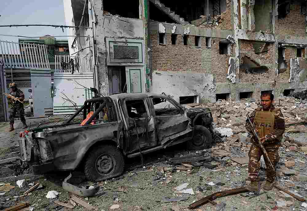 A member of Afghan security force inspects the site of yesterday's attack in Kabul, Afghanistan July 29, 2019. u00e2u20acu201d Reuters pic