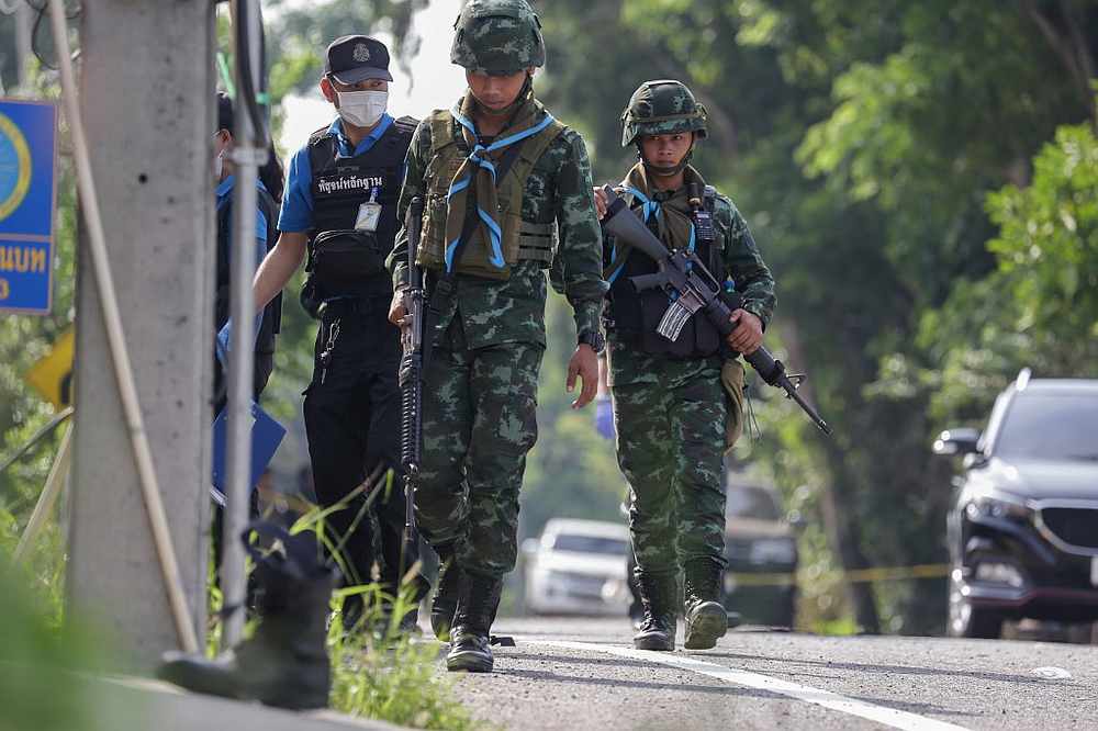 Police investigators and armed soldiers arrive at the site following an attack by militants at a military checkpoint in Pattani July 24, 2019. u00e2u20acu201d AFP pic
