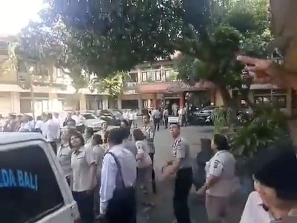People gathered outside look at a building, as an undersea quake struck south of Bali, at Barat Daya in Nusa Dua, Bali July 16, 2019. u00e2u20acu201d Thoriq Rizky/social media pic via Reuters