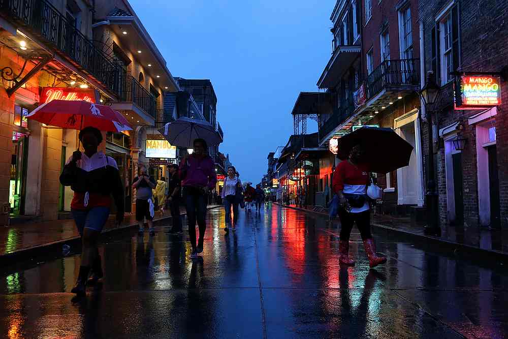 Tourists walk on Bourbon St during Hurricane Barry in New Orleans, Louisiana July 13, 2019. u00e2u20acu201d Reuters pic