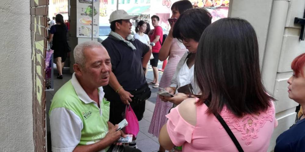 The elderly blind ticket seller can be found around Gunung Rapat, Pasir Pinji, Ipoh Jaya, Jalan Permaisuri Bainun, the Old Town areas and Concubine Lane in Ipoh. u00e2u20acu2022 Picture courtesy of Big Sweep