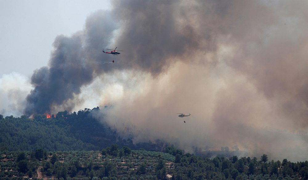 Helicopters drop water over a forest fire near Bovera, west of Tarragona, Spain June 27, 2019. u00e2u20acu201d Reuters 