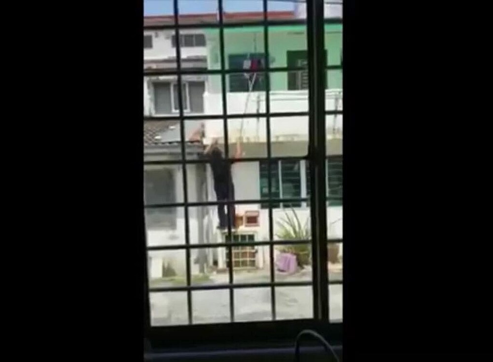 Screengrab of the 'underwear thief' caught on camera by a resident in SS 15 Subang Jaya. u00e2u20acu201d YouTube/SubangJayaEcho image
