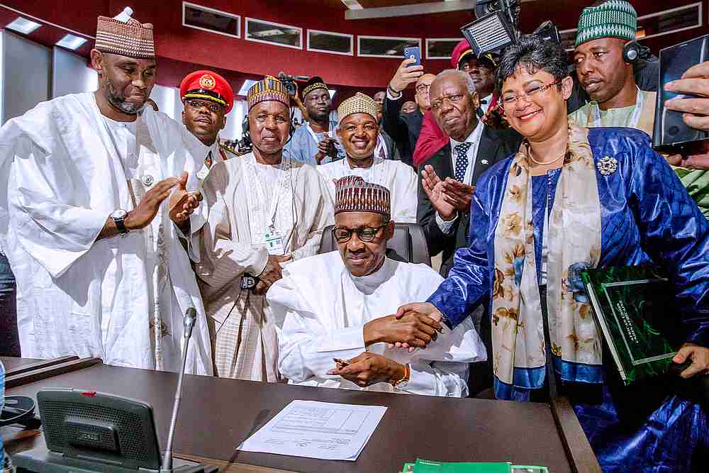 Nigerian President Muhammadu Buhari signs an agreement ahead of the lauching of the African Continental Free Trade Area (AfCFTA), during African Union summit in Niamey, Niger July 7, 2019. u00e2u20acu201d Nigeria Presidency/Handout via Reuters