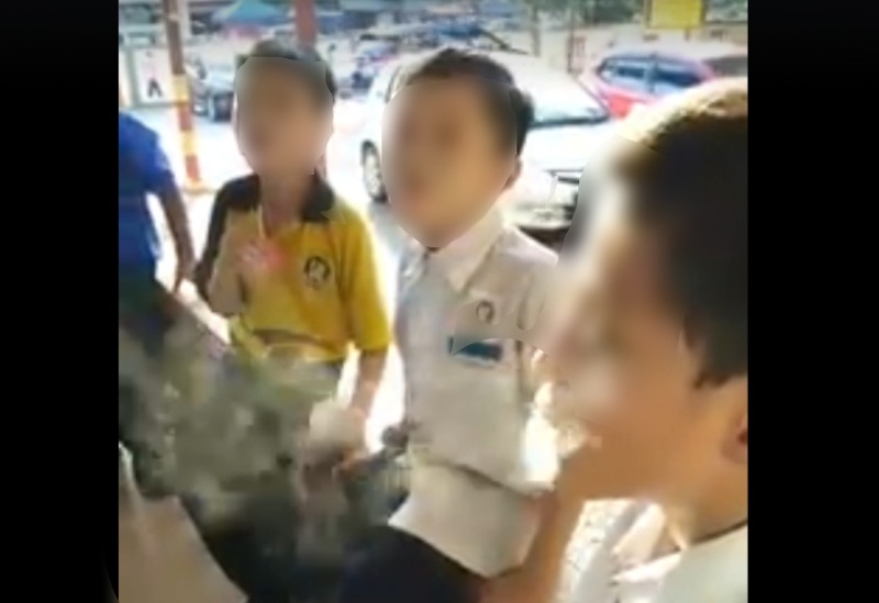 Screengrab of the students smoking the candy-like vape in a viral video. u00e2u20acu2022 Picture via Facebook/MohdFadliSalleh
