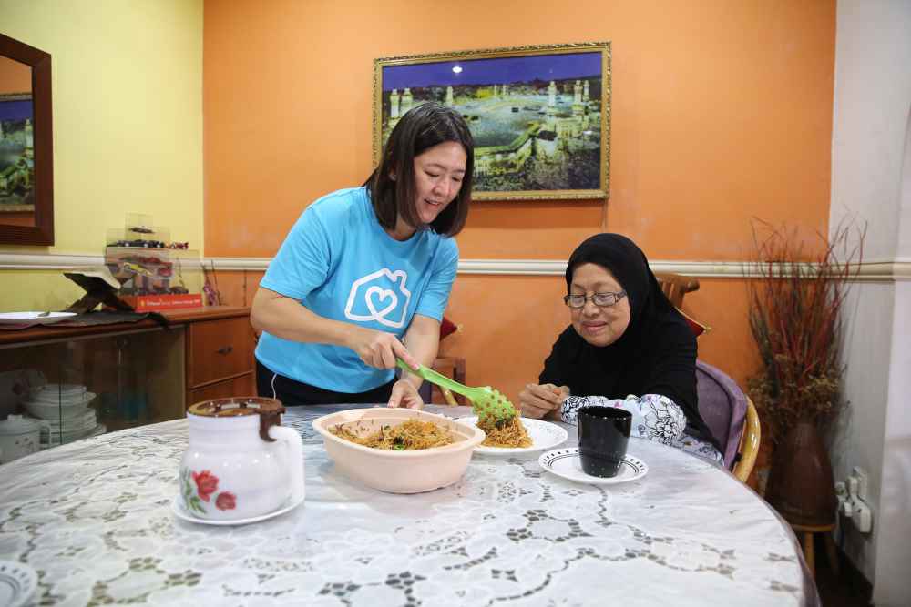 Yap is experienced in several caregiving duties such as meal preparation, feeding, diaper-changing, and showering. — Picture by Yusof Mat Isa