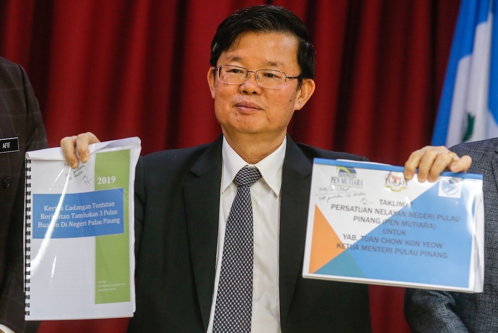 Penang Chief Minister Chow Kon Yeow showing the fishermen’s demands during a press conference in George Town July 12, 2019. — Picture by Sayuti Zainudin