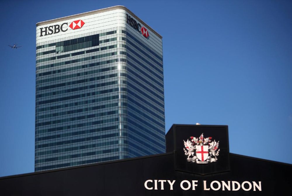HSBCu00e2u20acu2122s building in Canary Wharf is seen behind a City of London sign outside Billingsgate Market in London, August 8, 2018. u00e2u20acu201d Reuters pic