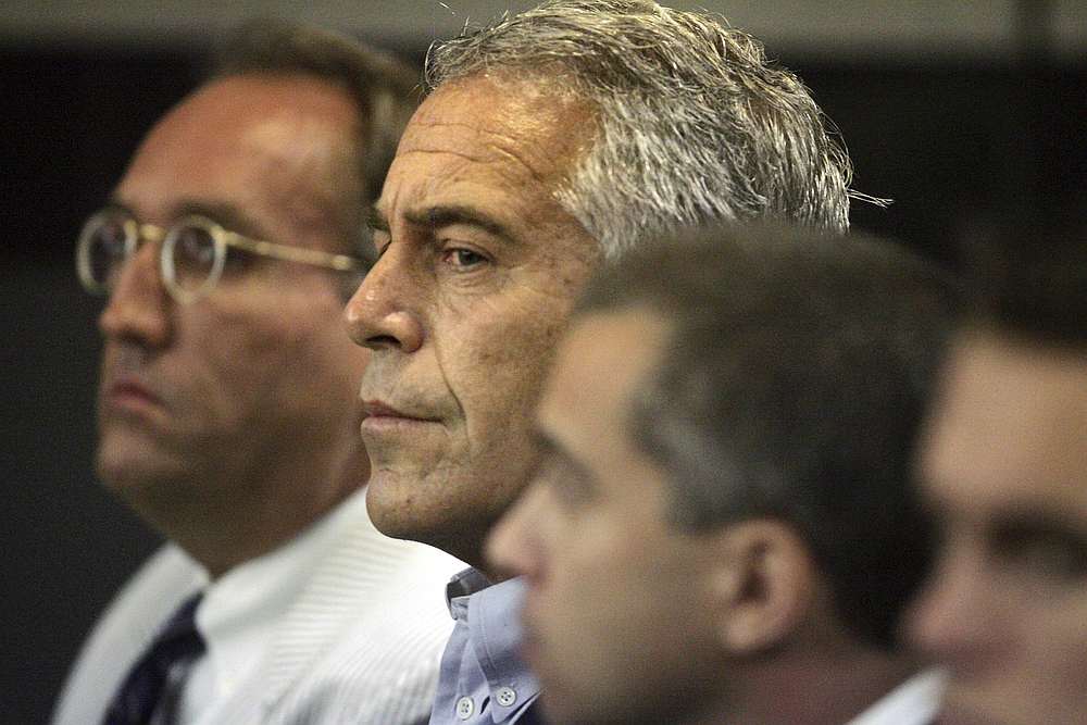 US financier Jeffrey Epstein (centre) appears in court where he pleaded guilty to two prostitution charges in West Palm Beach, Florida July 30, 2008. u00e2u20acu201d Uma Sanghvi/Palm Beach Post pic via Reuters