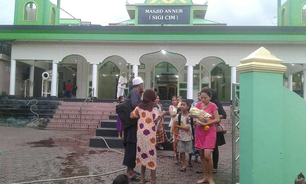 People gather outside a mosque following an earthquake at Labuha in South Halmahera, North Maluku, Indonesia, July 14, 2019. u00e2u20acu201d Antara Foto pic via Reuters
