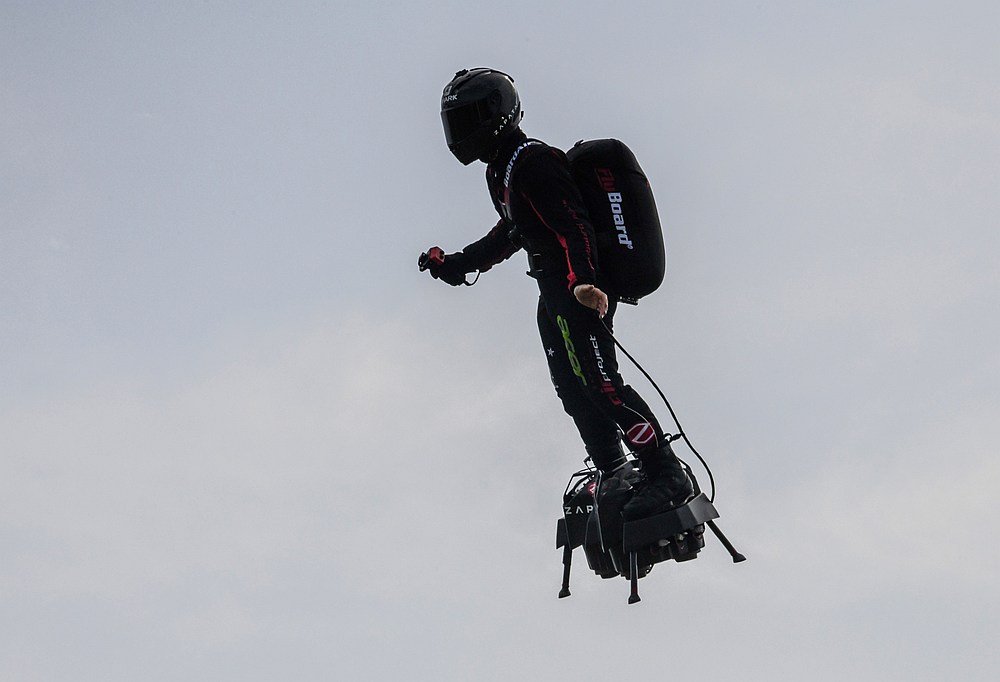 Zapata CEO Franky Zapata flies on his jet-powered hoverboard or 'Flyboard' during a test flight in Saint-Inglevert, northern France. u00e2u20acu201d AFP pic