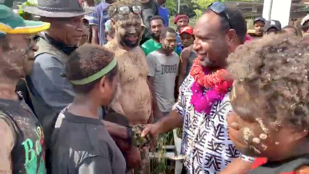 PNG Prime Minister James Marape receives the garlands after visiting a shelter for people displaced by an eruption at Mount Ulawun, in West New Britain June 30, 2019. u00e2u20acu201d West New Britain Provincial Disaster Office video image via Reuters