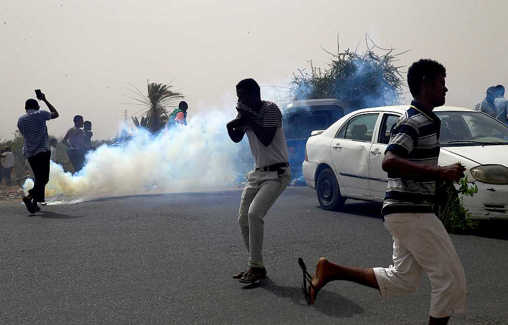 Sudanese run away from teargas fired to disperse them as they march on the streets demanding the ruling military hand over to civilians during a demonstration in Khartoum North, Sudan June 30, 2019. u00e2u20acu201d Reuters pic