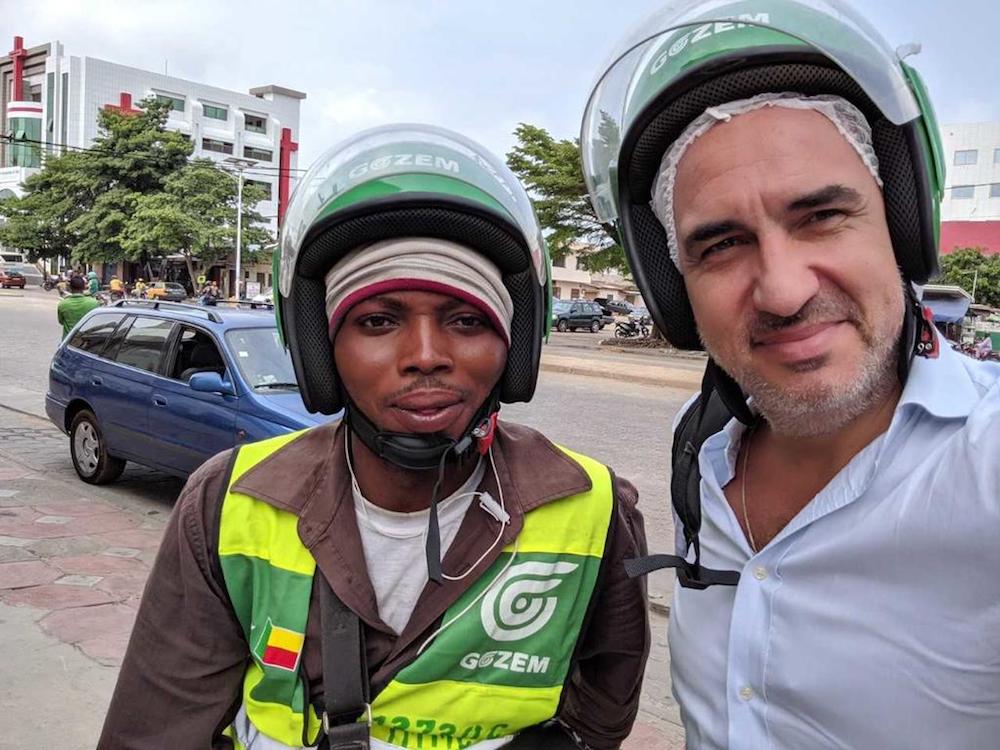 Singapore-based Swiss expat, Raphael Dana (right), in the West African nation of Benin with a driver who has signed up with the start-up he co-founded called Gozem. u00e2u20acu201d Handout via TODAY