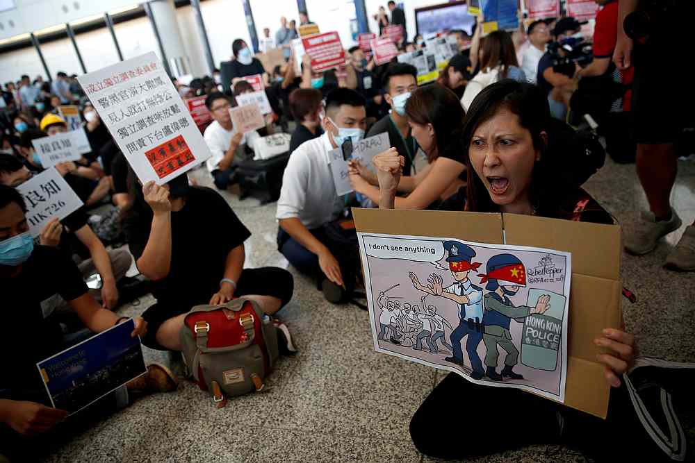 Protesters and members of the aviation industry stage a protest against the recent violence in Yuen Long, at Hong Kong airport July 26, 2019. u00e2u20acu201d Reuters pic