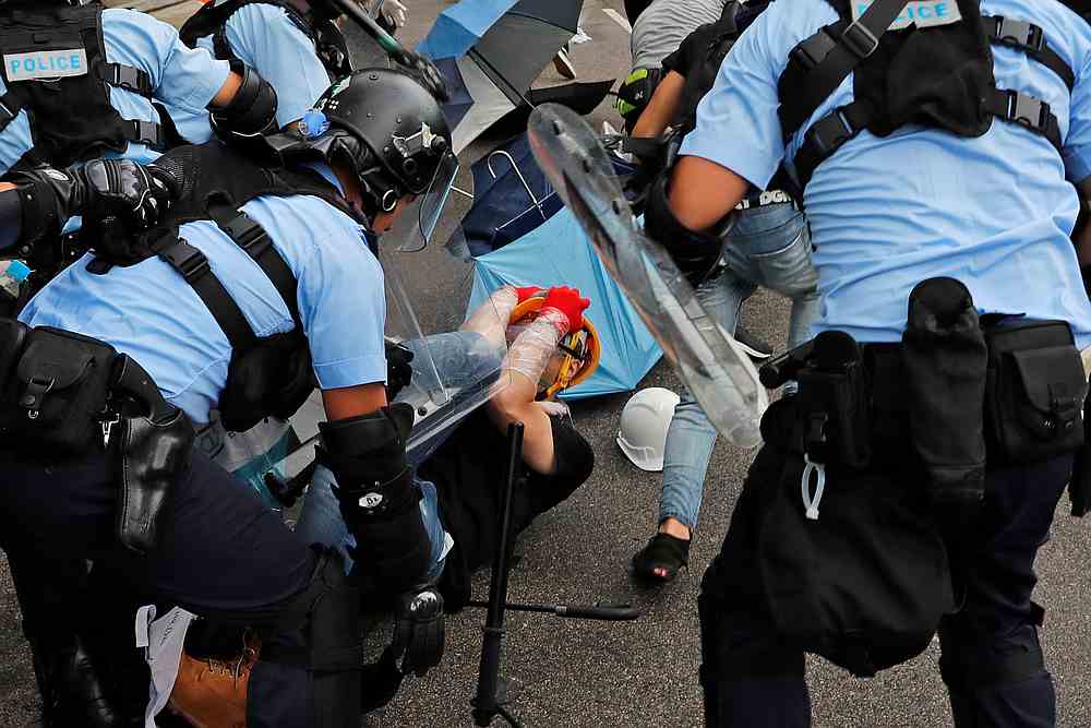 Riot police try to disperse protesters on the anniversary of Hong Kong's handover to China in Hong Kong July 1, 2019. u00e2u20acu201d Reuters pic