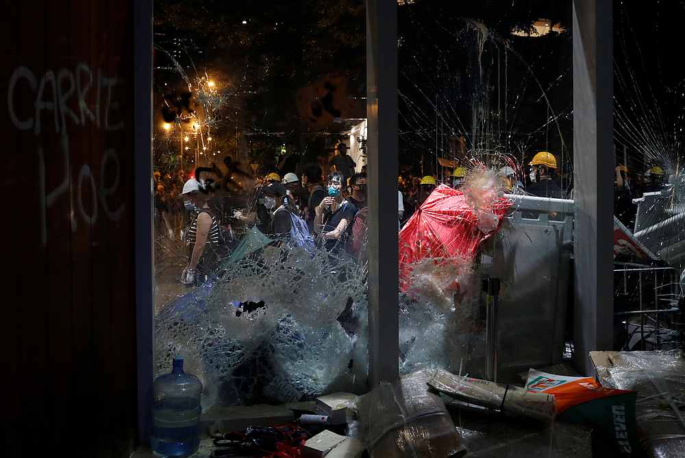 Broken glass doors are seen after demonstrators stormed the Legislative Council building on the anniversary of Hong Kong's handover to China July 1, 2019. u00e2u20acu201d Reuters pic