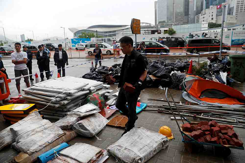 Police officers display objects used during a demonstration outside the Legislative complex in Hong Kong, July 3, 2019. u00e2u20acu201d Reuters pic