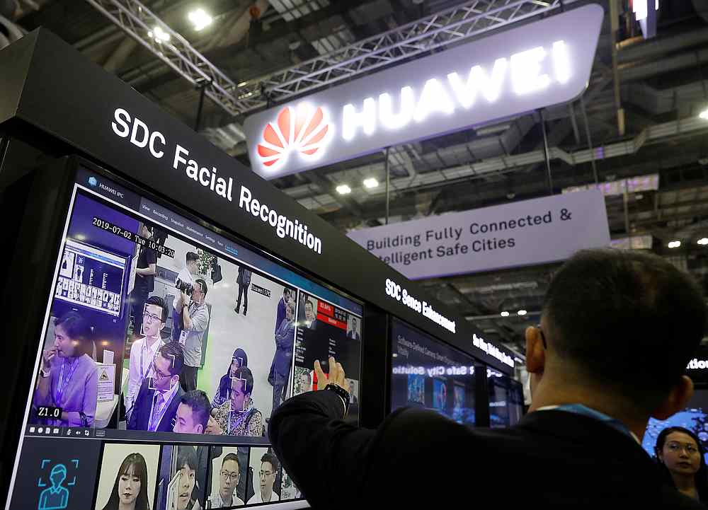 A Huawei employee showcases their facial recognition technology at their booth at Interpol World in Singapore July 2, 2019. u00e2u20acu201d Reuters pic