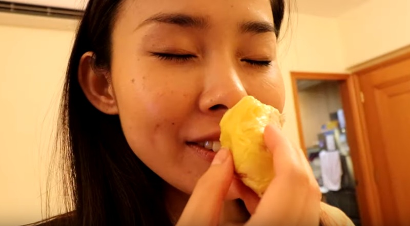 YouTuber iChang smelling the Durian that she bought to check if it is still fresh. u00e2u20acu2022 Screengrab from Youtube/ iChang Hong Kong
