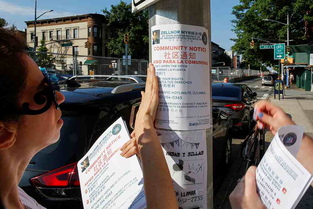Community members place pamphlets while preparing for a reported wave of deportation raids across the United States by Immigration and Customs Enforcement officers in Brooklyn, New York July 14, 2019. u00e2u20acu201d Reuters pic