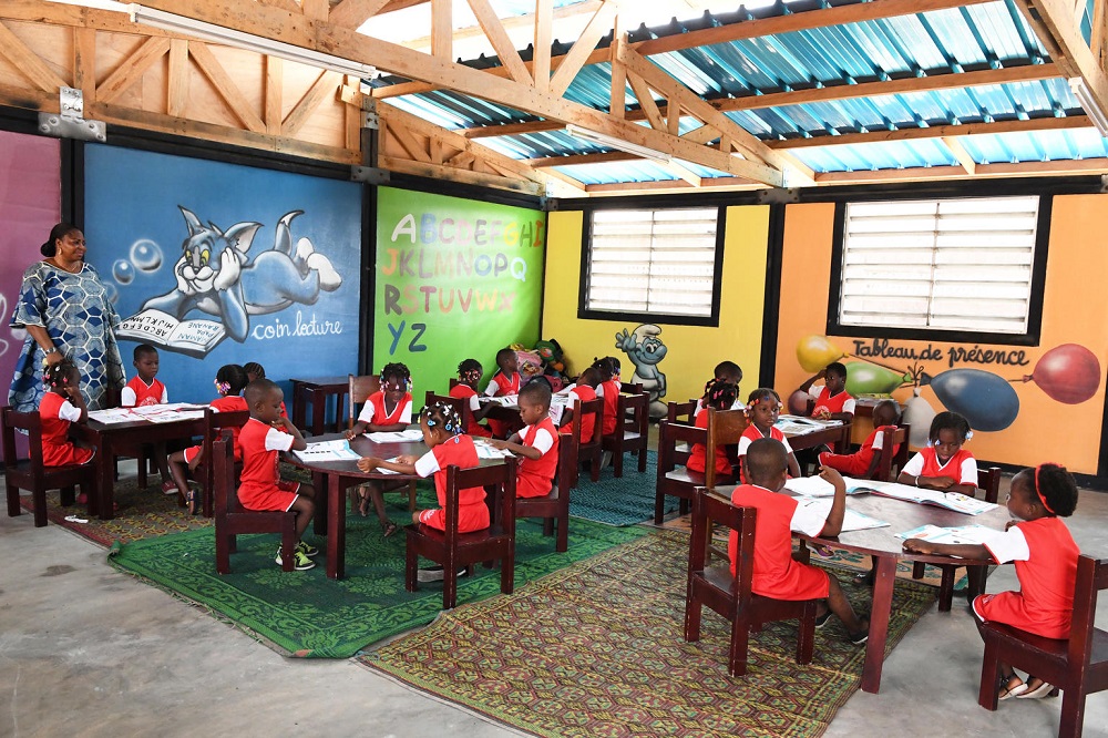 Children and teachers in a preschool built using plastic bricks in Gonzagueville, a suburban of Abidjan, Ivory Coast. u00e2u20acu201d Frank Dejongh/Unicef/Reuters pic
