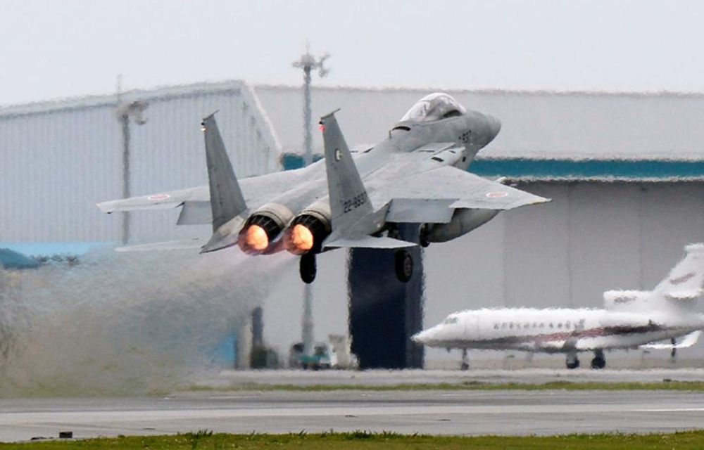 File picture shows a Japanese Air Self Defense Force F-15 fighter scrambling at the Air Self Defense Force Naha base in Naha, Okinawa prefecture, Japan, April 13, 2015. u00e2u20acu201d Kyodo picture via Reuters