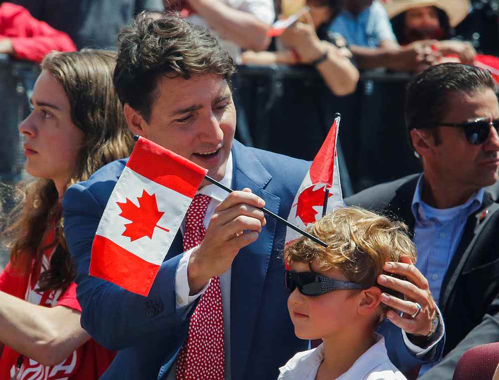 Prime Minister Justin Trudeau puts flags in his son Hadrien's hair during Canada Day festivities on Parliament Hill in Ottawa, Ontario July 1, 2019. u00e2u20acu201d Reuters pic