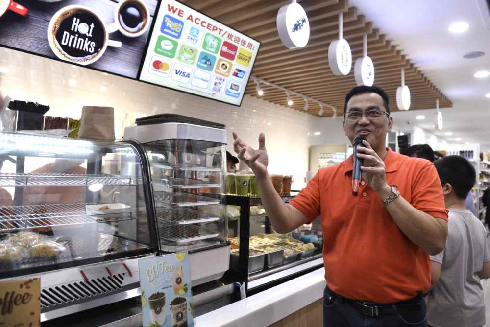 KK Group of Companies founder and group executive chairman Datuk Seri Dr KK Chai giving a tour of the store. 