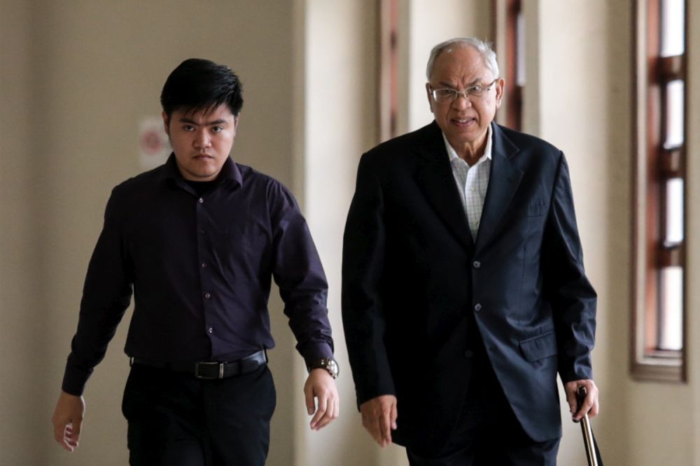 Datuk Suboh Md Yassin (right) arrives at the Kuala Lumpur Court Complex July 1, 2019. u00e2u20acu2022 Picture by Ahmad Zamzahuri