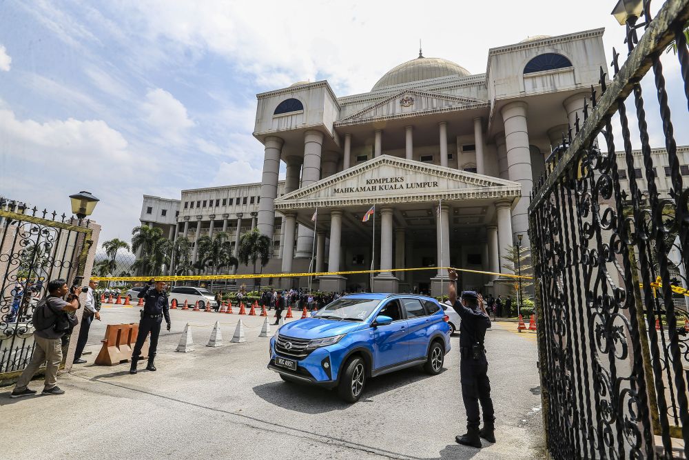 Police cordon off the Kuala Lumpur Court Complex with yellow tape following a bomb threat July 25, 2019. u00e2u20acu2022 Picture by Firdaus Latif