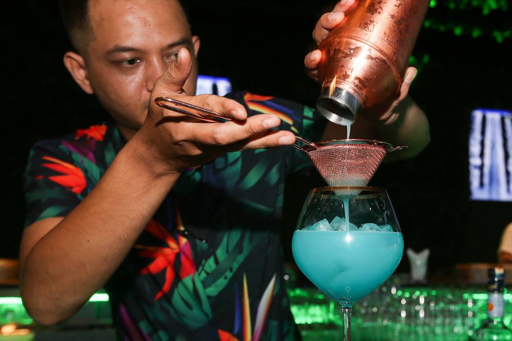 A bartender prepares one of Marimbaru00e2u20acu2122s signature cocktail, Blue Moon. u00e2u20acu201d Picture by Choo Choy May