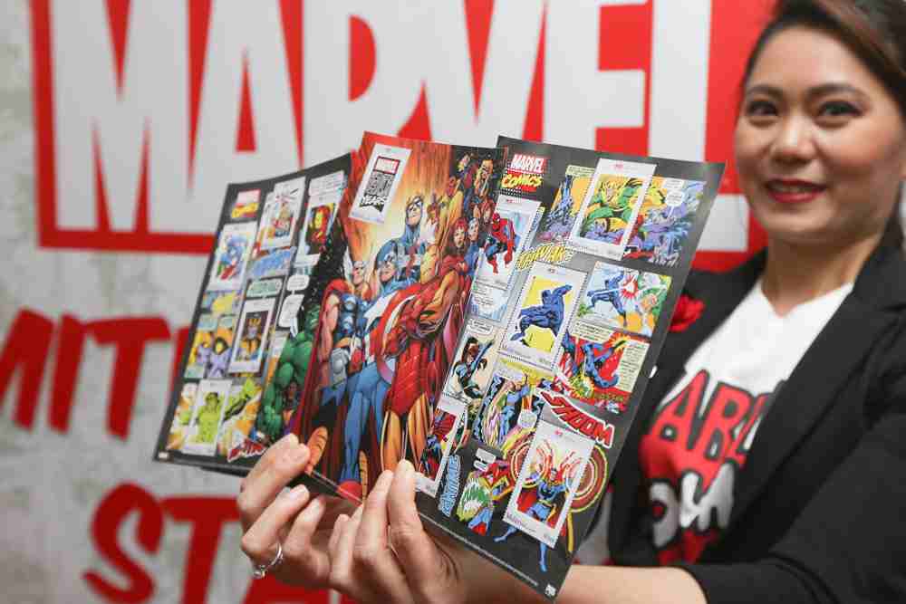 Pos Malaysia’s senior vice president of marketing, Schrene Goh, showing off the Marvel superhero stamp set.