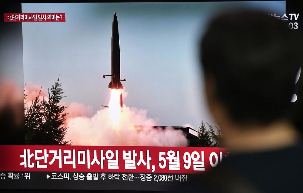 A man watches a television news screen showing a file footage of a North Korean missile launch, at a railway station in Seoul July 25, 2019. u00e2u20acu201d AFP pic