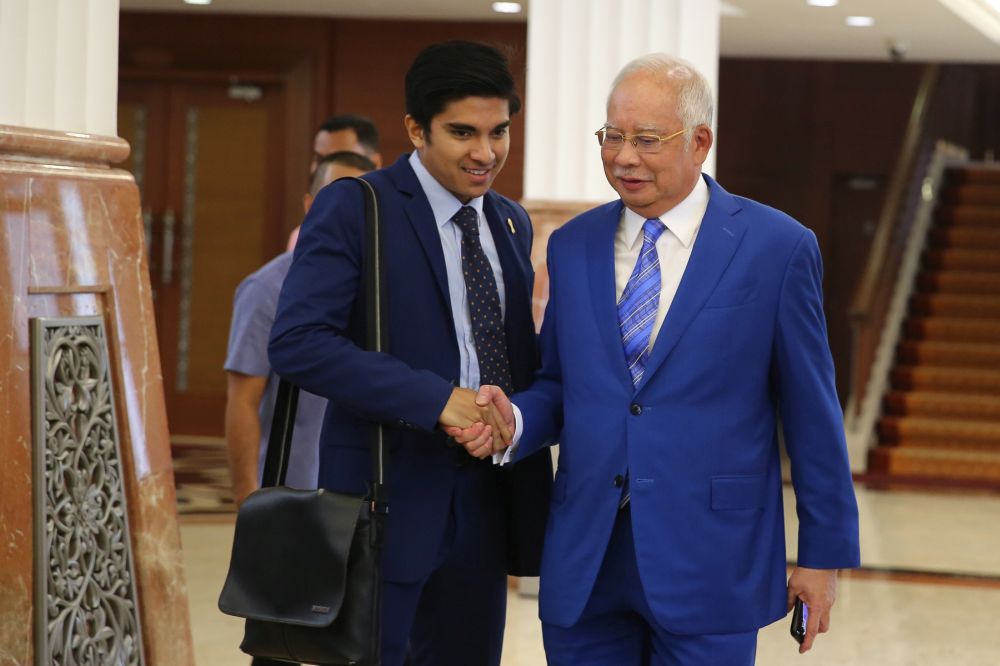 Youth and Sports Minister Syed Saddiq Syed Abdul Rahman greets Pekan MP Datuk Seri Najib Razak at the Parliament lobby in Kuala Lumpur July 4, 2019. u00e2u20acu201d Picture by Yusof Mat Isa